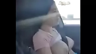 girl has her big tits out in the car