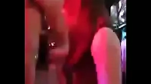 two girls teasing in the club